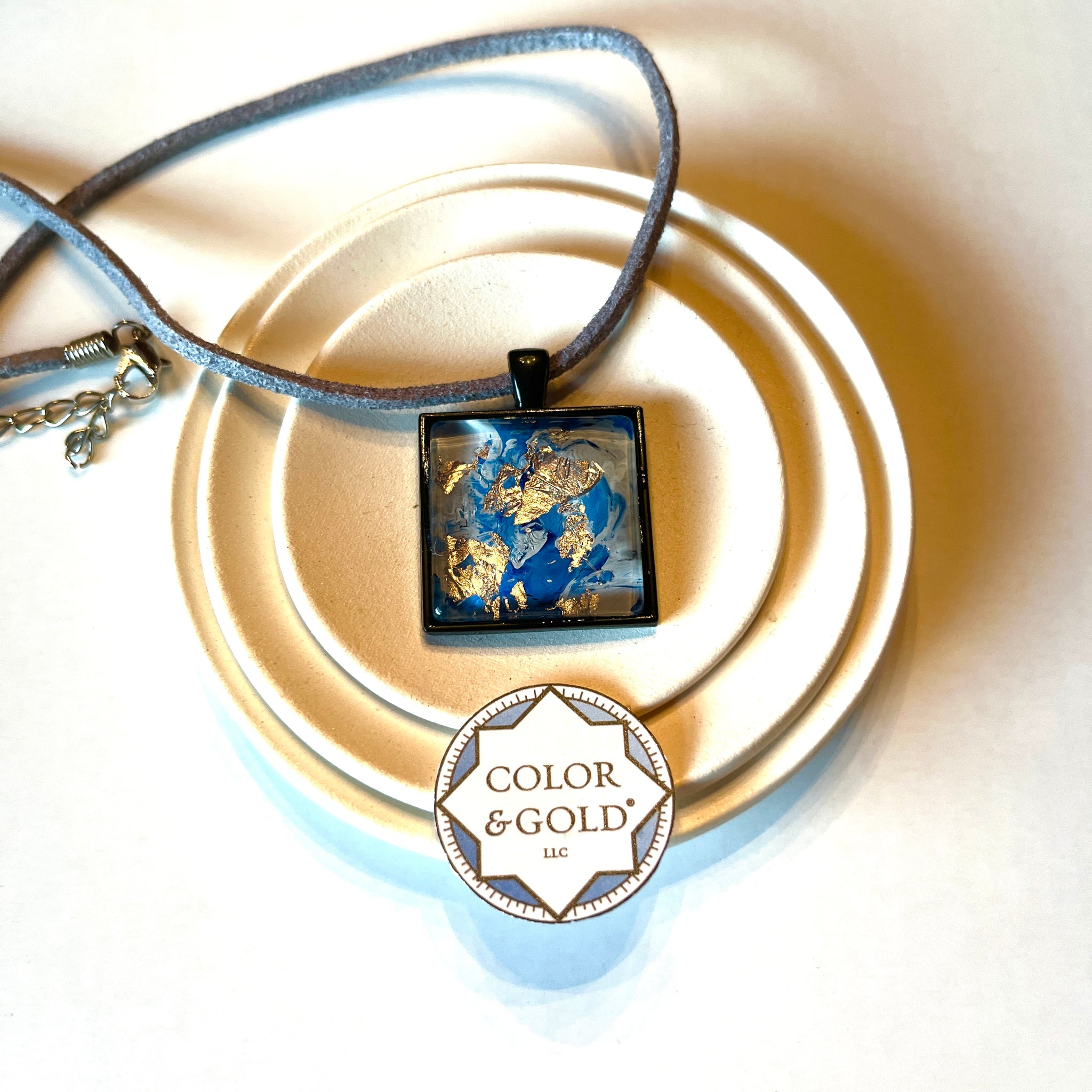 Necklace 25x25mm Blue and Light Grey 9” adjustable black cord hand gilded with Caplain leaf